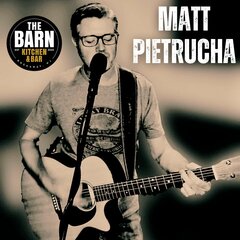 MATT PIETRUCHA. playing and singing with guitar. The Barn logo.