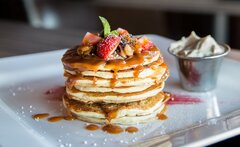 Stack of Pancakes with Strawberries and Cream